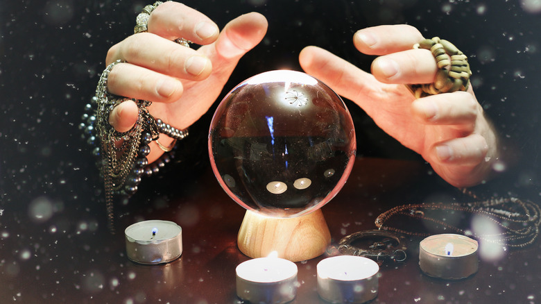 Hands over a crystal ball