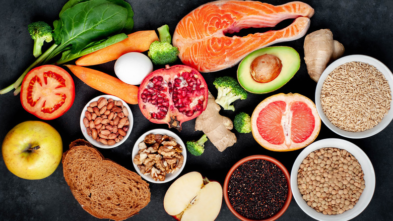 Spread of salmon, avocado, fruits, vegetables, grains