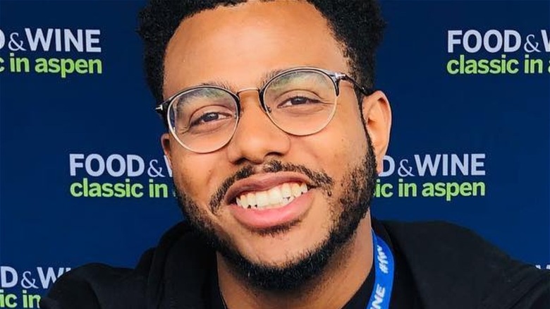 Kwame Onwuachi wearing glasses