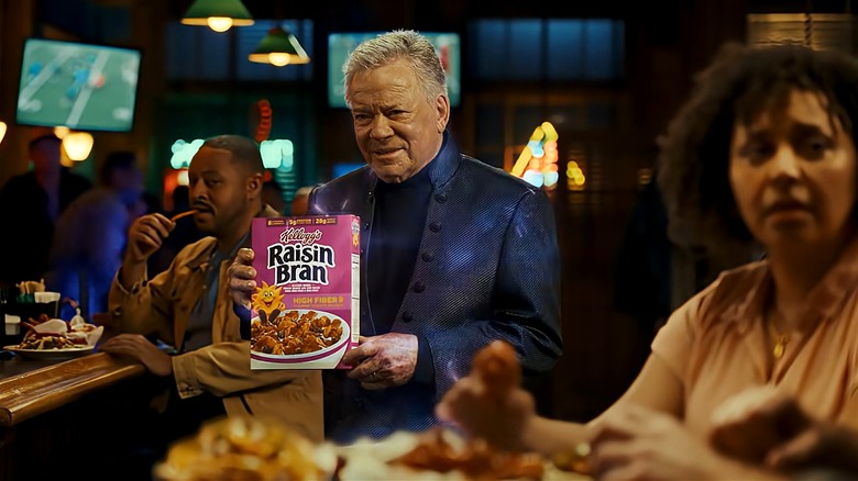 William Shatner holding a box of Raisin Bran in a still from a Super Bowl LX commercial.