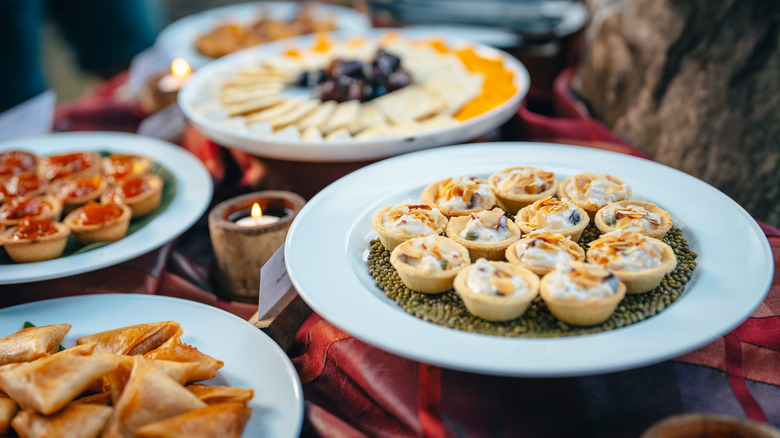 assorted appetizers and finger foods on display