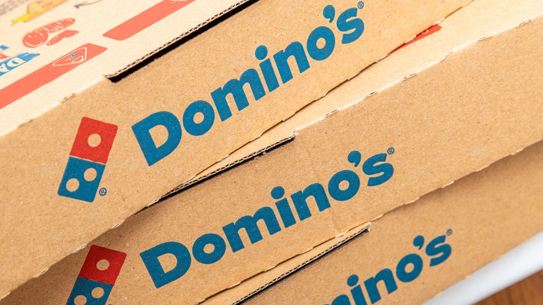 A stack of Domino's pizza boxes