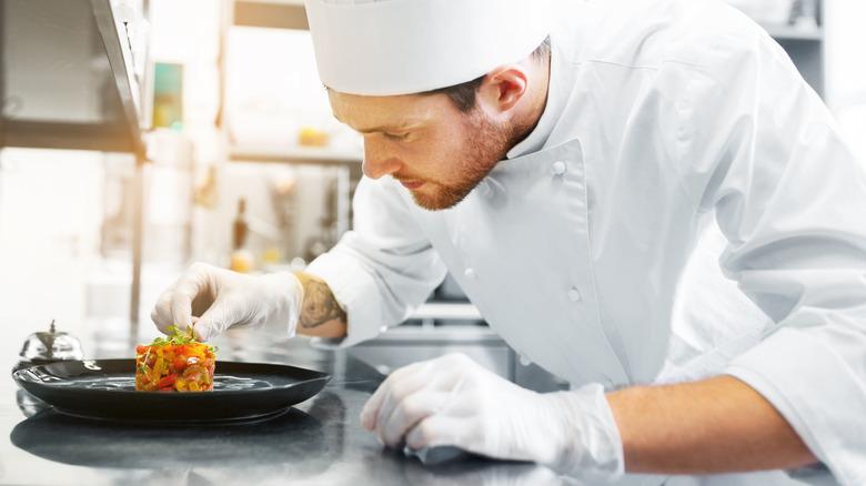 chef finishing a plate