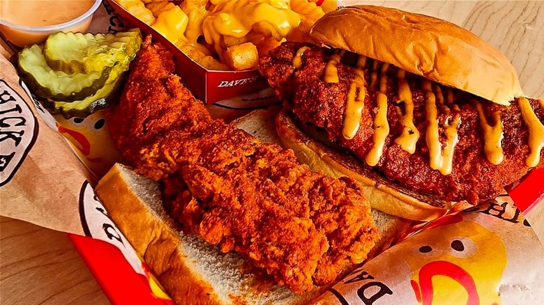Dave's chicken tenders and sandwich with fries and pickles