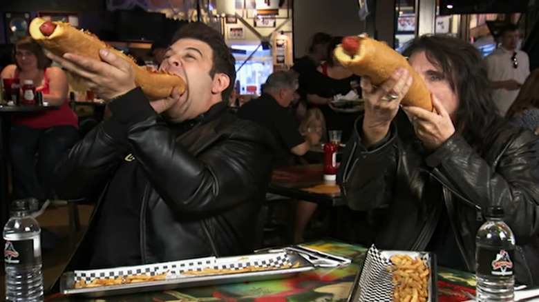 Adam Richman with Alice Cooper and giant hot dogs