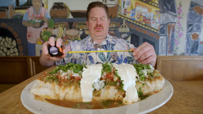 Casey Webb measuring big burrito