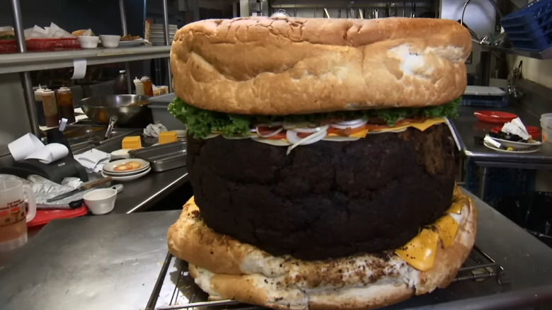 Massive burger in kitchen