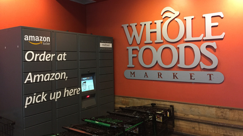 Amazon kiosk at Whole Foods store next to shopping carts