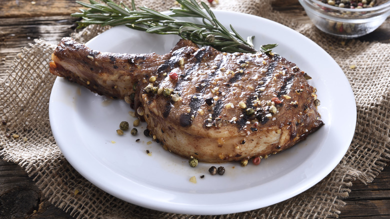 Pork Chops On Wooden Board