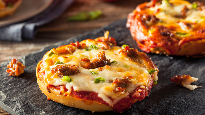 Pizza bagels sitting on a tray