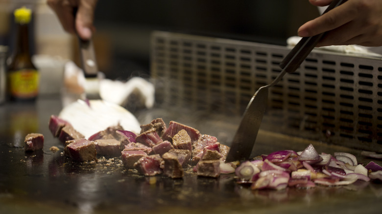 steak cooking on hibachi grill