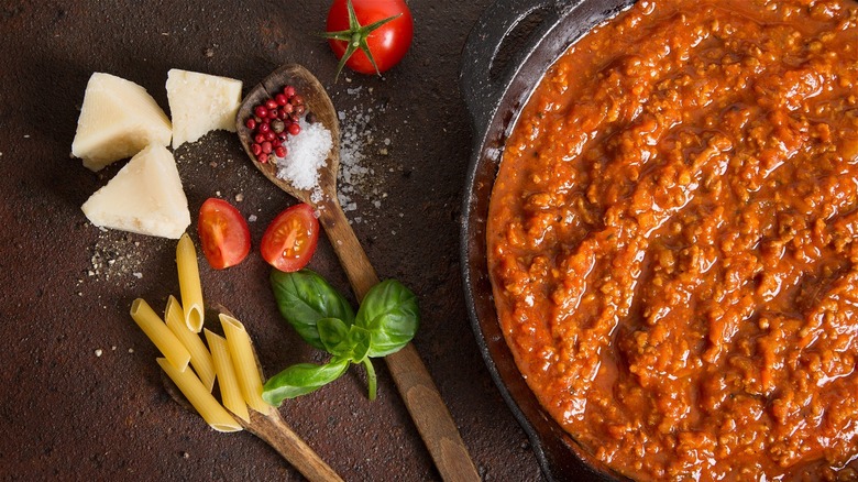 pasta sauce with basil, noodles, and cheese