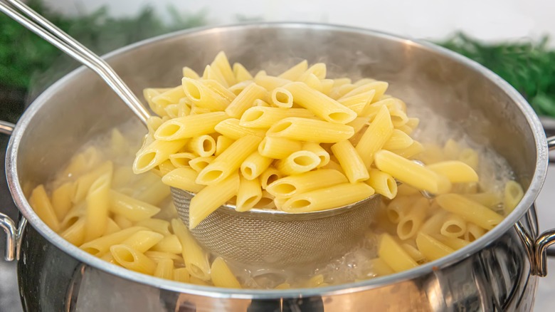 Cooking penne pasta in pot