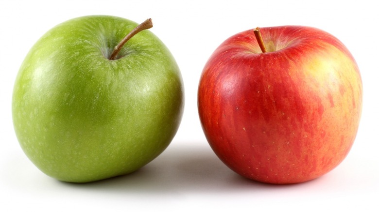 three colored apples on white