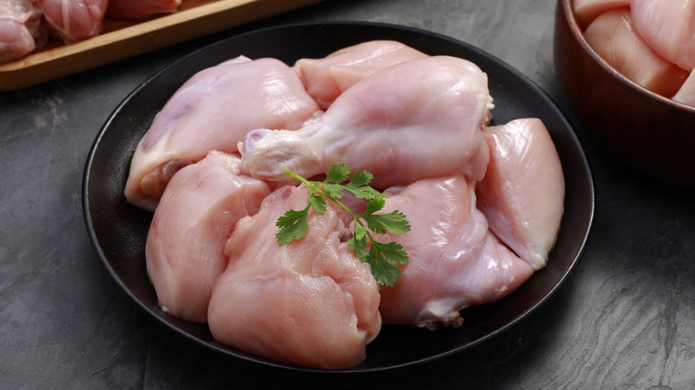a bowl of raw chicken