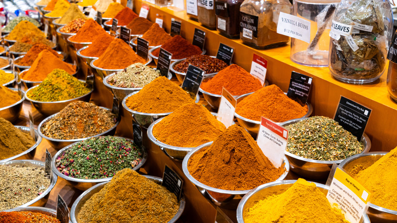 Bulk spice barrels at a spice shop