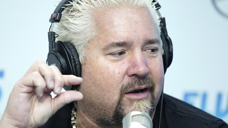 Guy Fieri wearing headphones