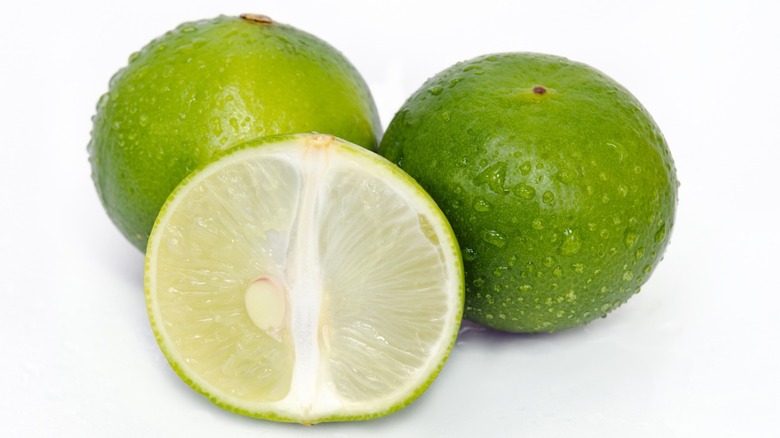 three Key limes on a white background