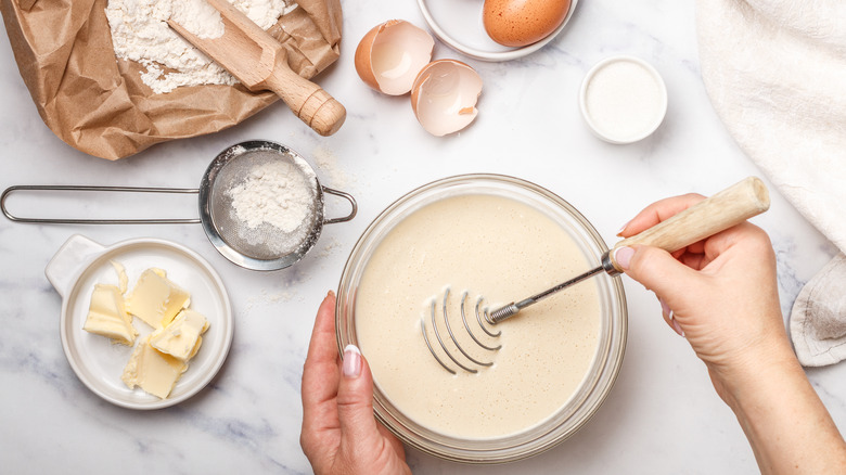 Mixing batter with butters and eggs