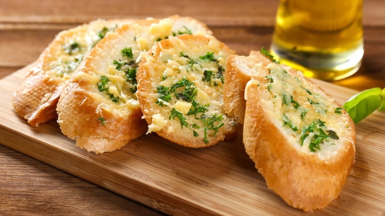 Garlic bread on a wooden platter