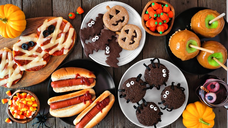 Halloween cookies, apples, and hot dogs