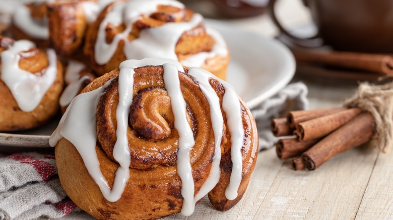Cinnamon rolls covered with icing drizzle