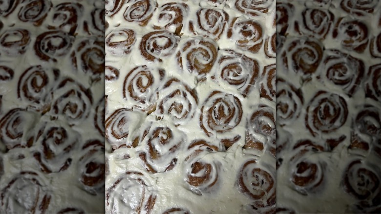 Tray of frosted cinnamon rolls from Devine Cinnamon Roll Deli