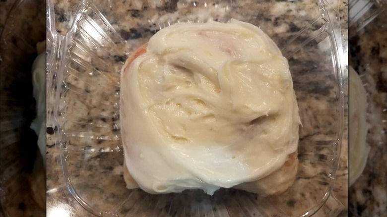 Frosted cinnamon roll from Parowan Cafe in a plastic container