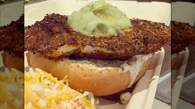 Blackened fish sandwich topped with wasabi butter