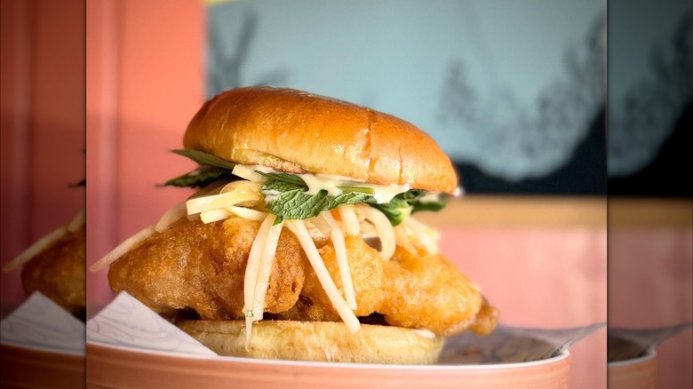 Fish sandwich garnished with slaw