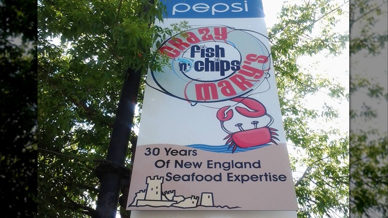 sign for crazy mary's with crab on it