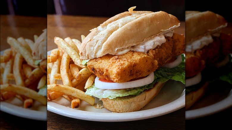 fish sandwich served with fries and tartar sauce