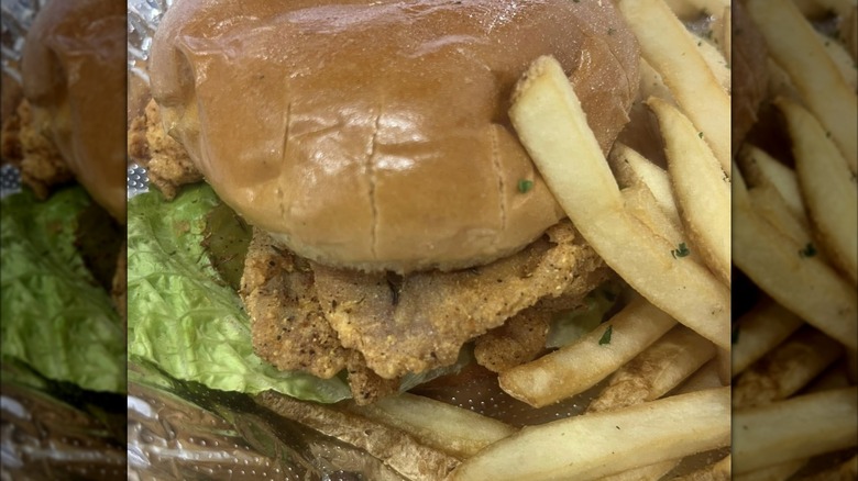 close up of fish sandwich with fries