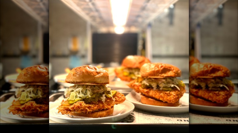 two fish sandwiches on plates