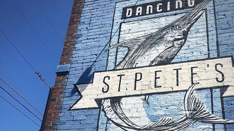 wall with st. pete's mural and marlin painted on side