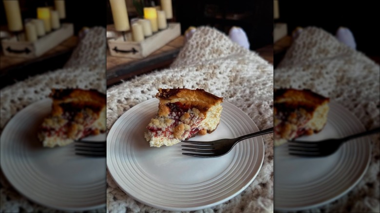 Slice of Costco's Strawberry Streusel Cheesecake on plate