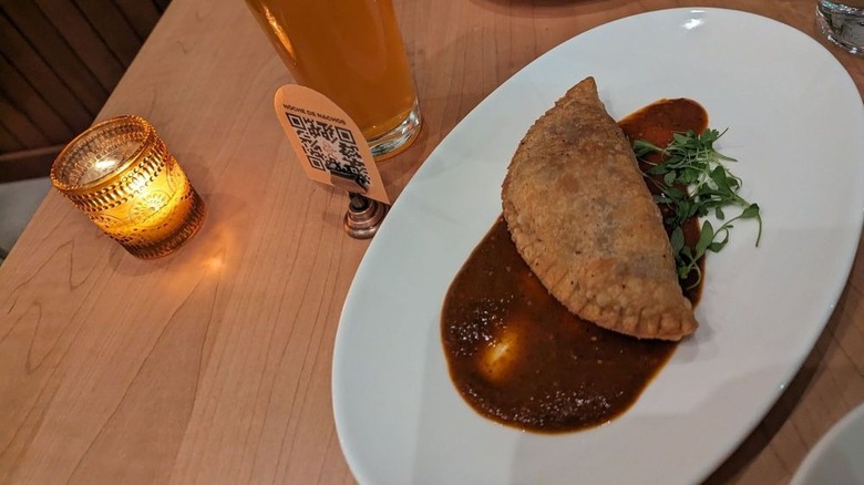 Empanada on table at La Semilla