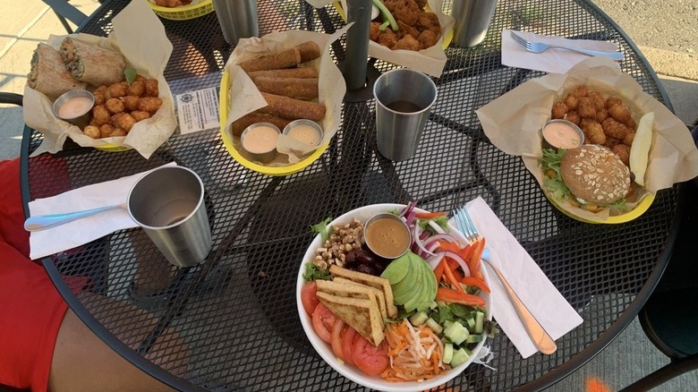 Various dishes on outdoor table at Detroit Street Filling Station