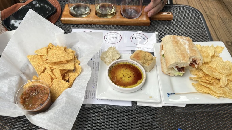 Plates of food and glasses of wine at 4e Winery
