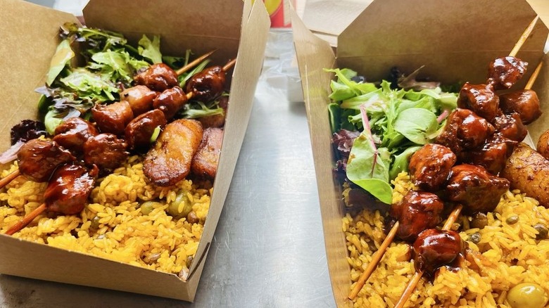 Sampler plate in takeout boxes at Casa Borinqueña