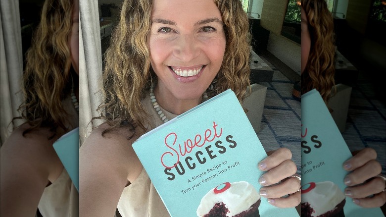 Candace Nelson holds her book Sweet Success