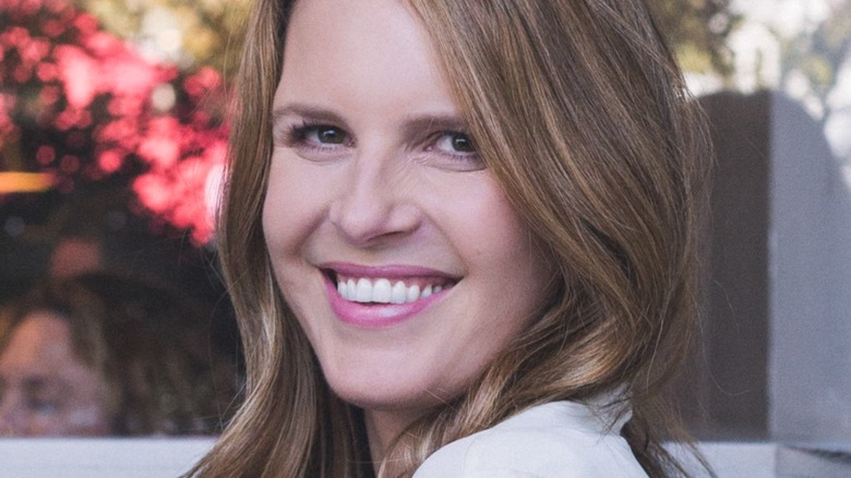 Candace Nelson sits on a deck