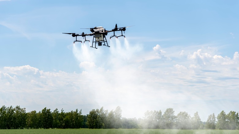 Drone spraying pesticides on crops