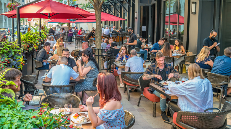 People eating on a patio at a restaurant in Toronto