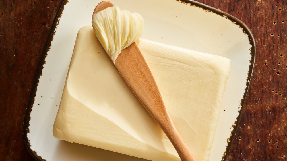 Butter on a wooden knife