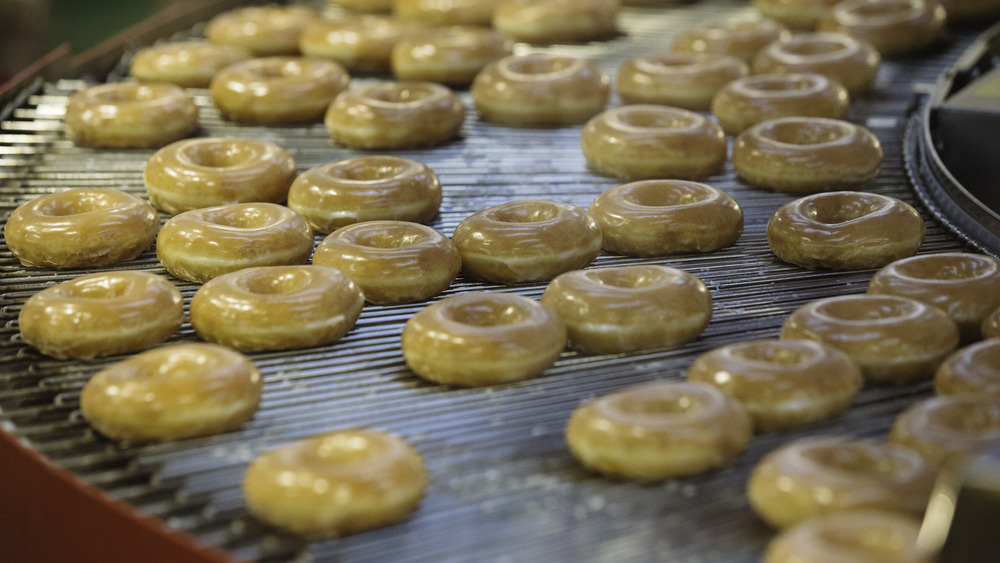 Krispy Kreme donuts on conveyer belt