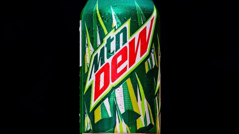 Can of Mountain Dew on black background