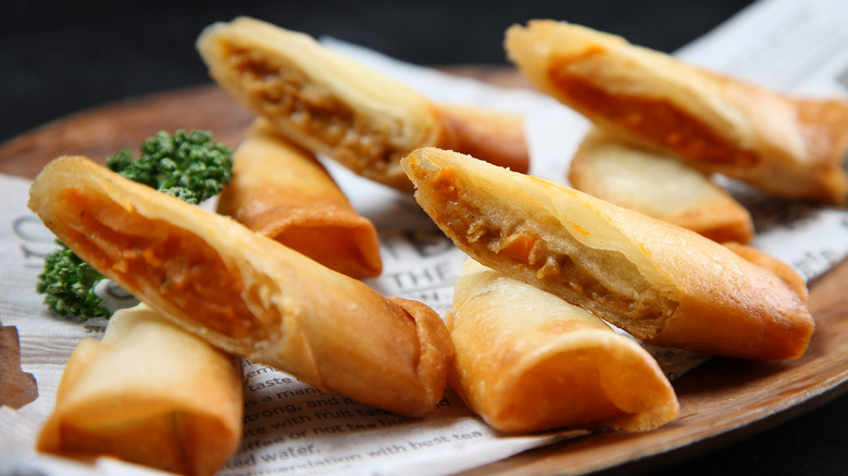 A stack of fried pizza rolls