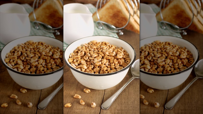 Bowl of Honey Smacks cereal on table with milk and toast