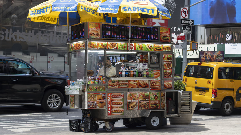 Hot dog cart with Sabrett umbrellas in NYC